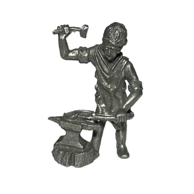 Tin Sculpture Of Working Blacksmith